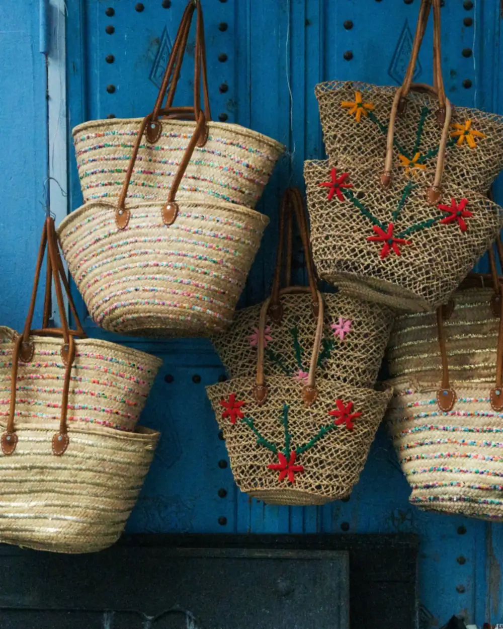 One woven straw tote made in several embroidery and colour variants