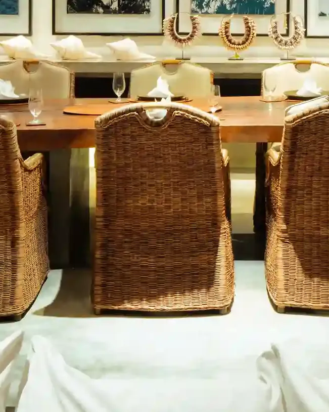 Close-up of a hand-woven rattan dining chair