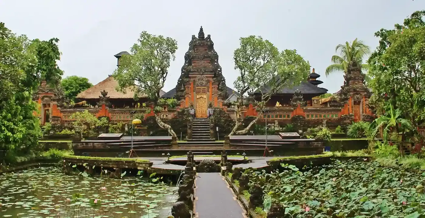 Lotus pond in front of a temple gate in Ubud