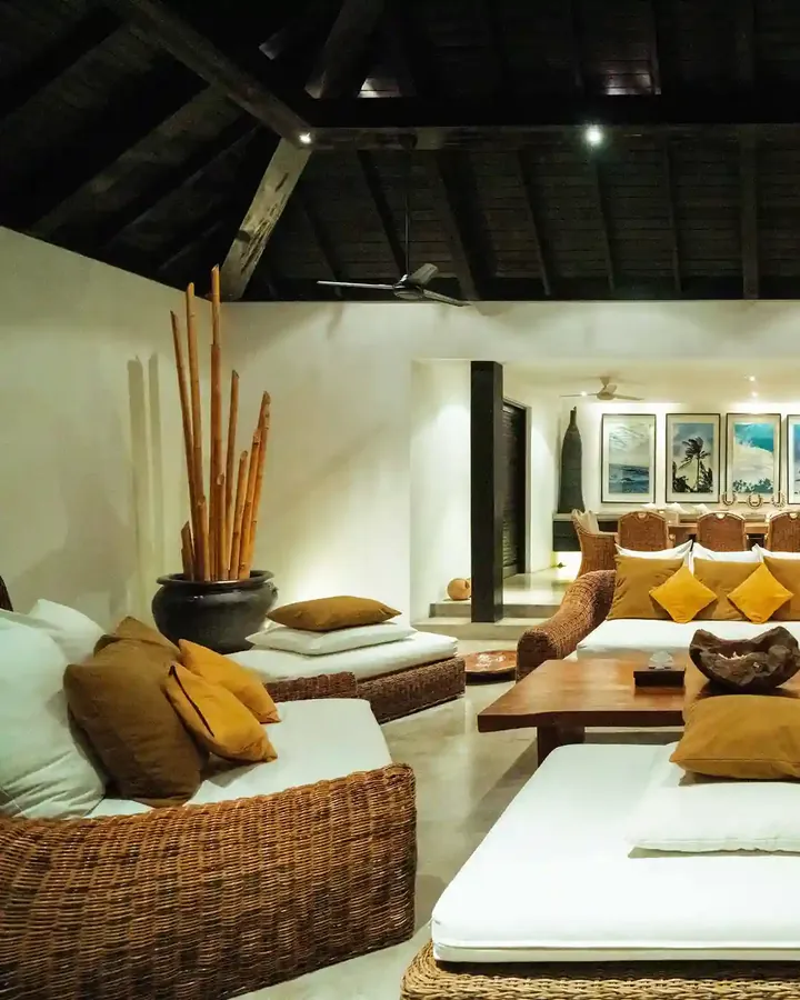 Villa living room furnished with rattan armchairs