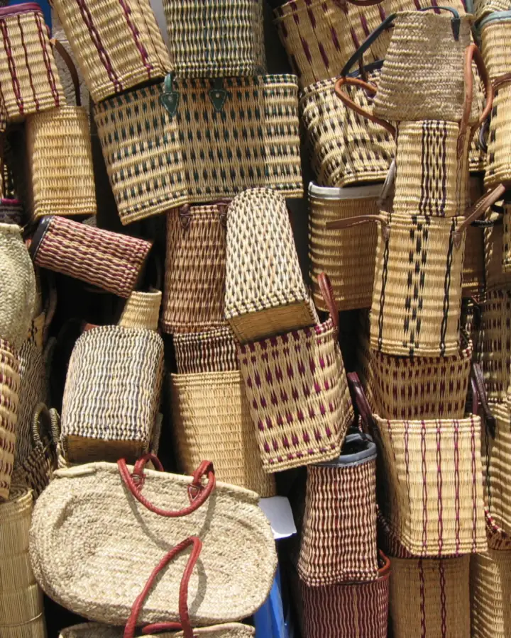 Stacks of woven baskets and bags ready for sale